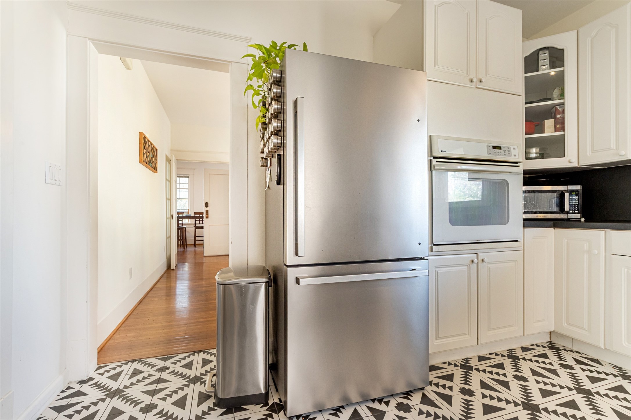 528 Hawthorne Street Houston, TX 77006 - Photo 21 of 34 a view of a refrigerator and wooden floor