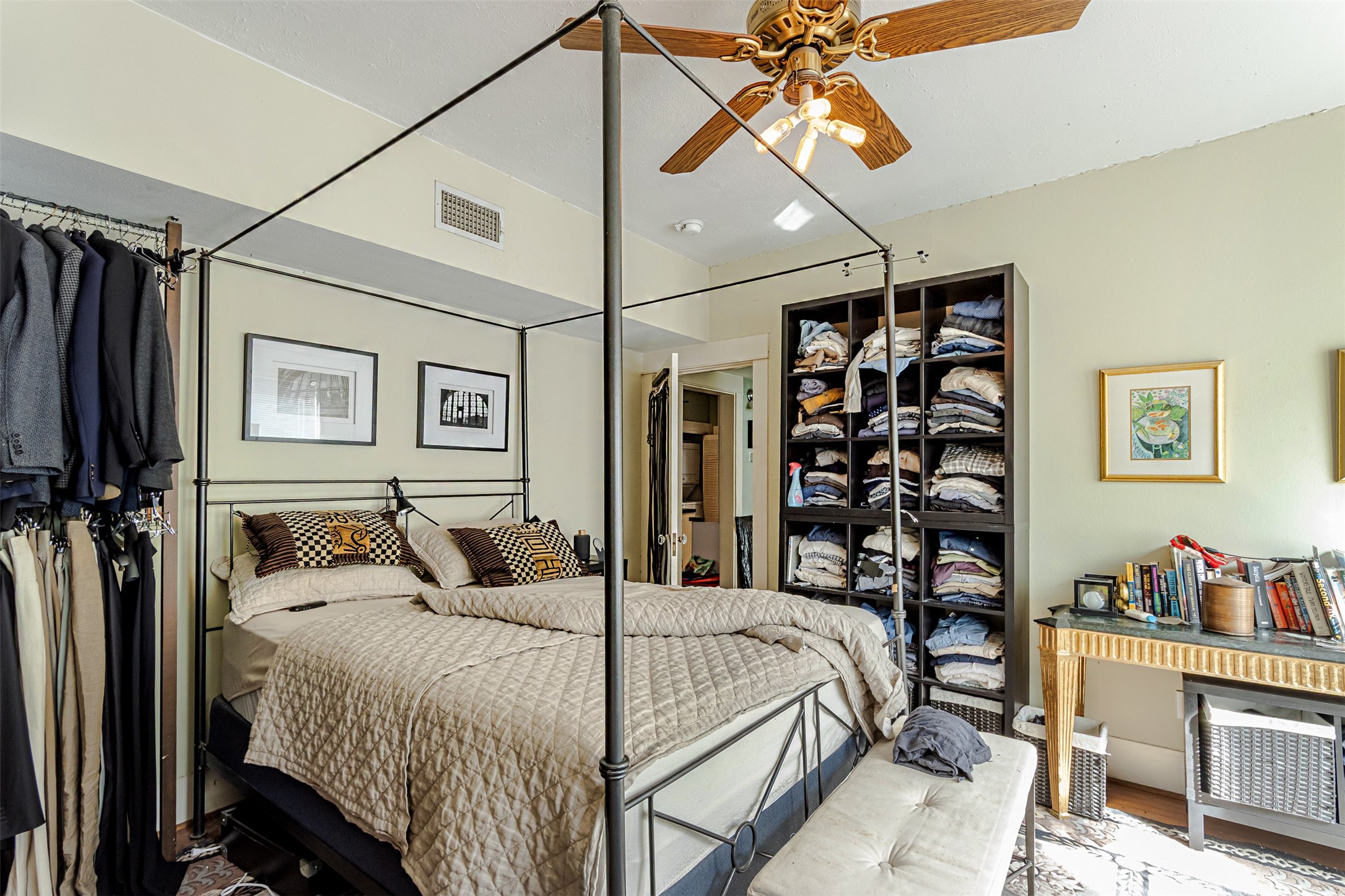 528 Hawthorne Street Houston, TX 77006 - Photo 8 of 34 a bedroom with a bed and a chandelier