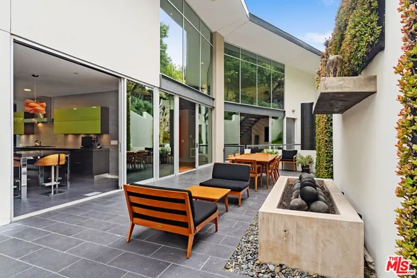a view of a swimming pool with an outdoor space and seating area