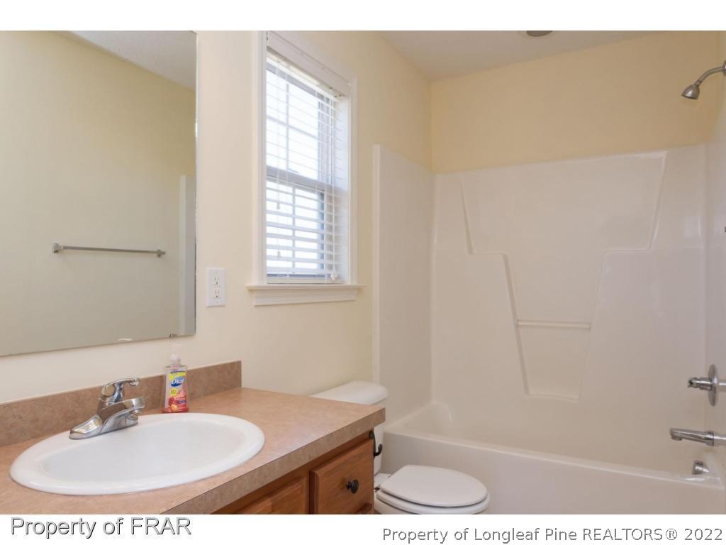 3689 Old Stage Road North Angier, NC 27501 - Photo 13 of 25 a bathroom with a sink and a mirror
