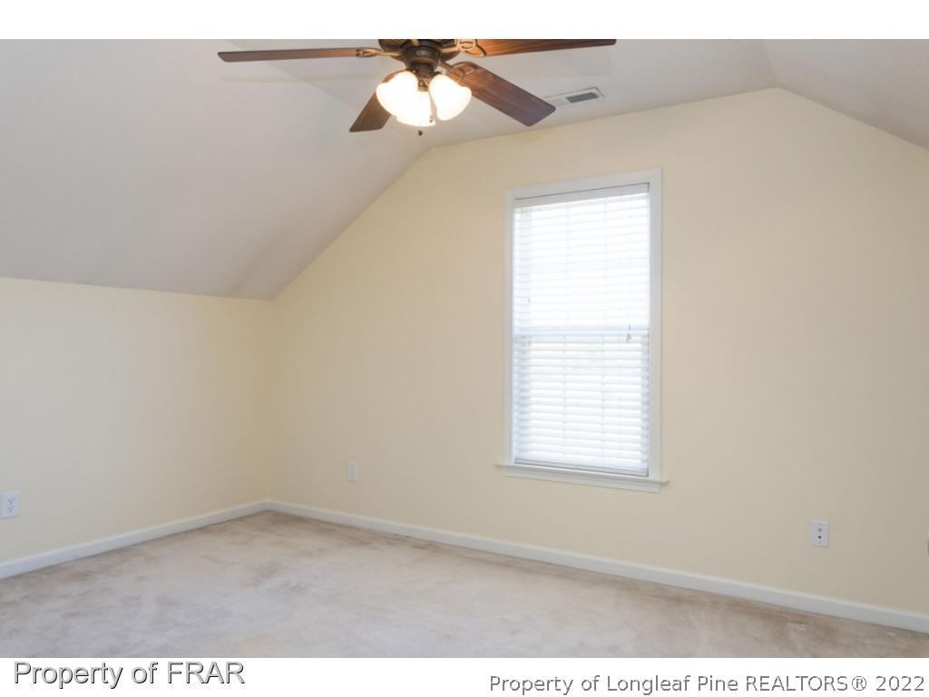 3689 Old Stage Road North Angier, NC 27501 - Photo 17 of 25 an empty room with a window and a ceiling fan