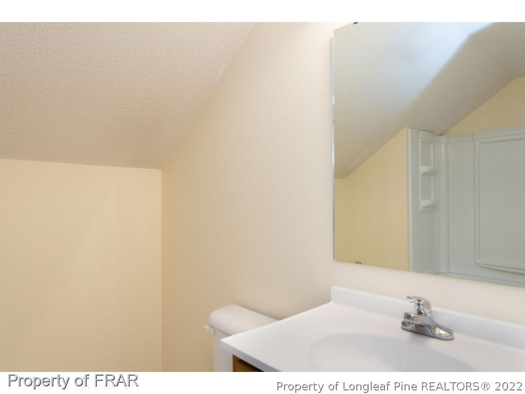 3689 Old Stage Road North Angier, NC 27501 - Photo 18 of 25 a bathroom with a sink and a mirror
