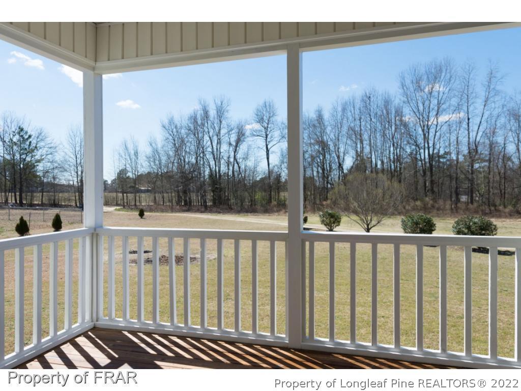 3689 Old Stage Road North Angier, NC 27501 - Photo 23 of 25 a view of a wooden balcony