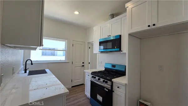 a kitchen with a stove and a sink