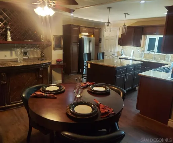 a kitchen with a table and chairs in it