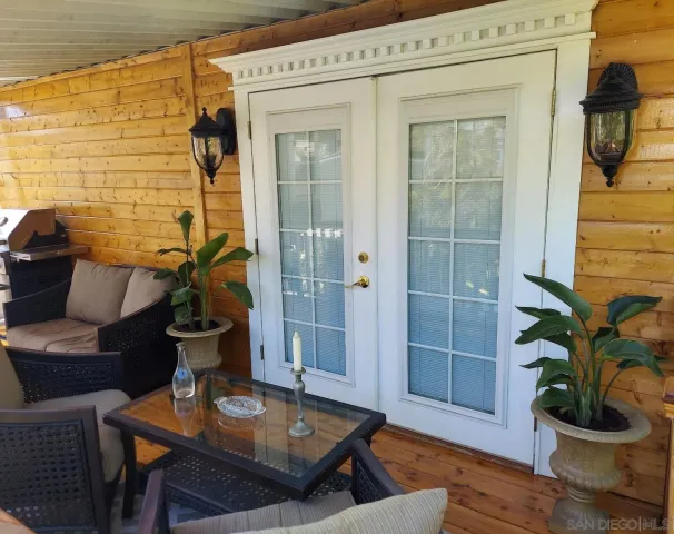 a view of a entryway with flower pots