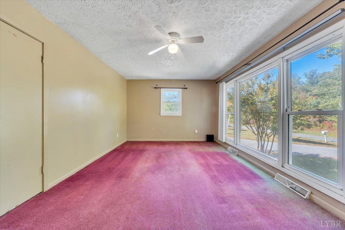 4152 Blue Ridge Drive Gretna, VA 24557 - Photo 12 of 74 an empty room with windows and view of an empty room