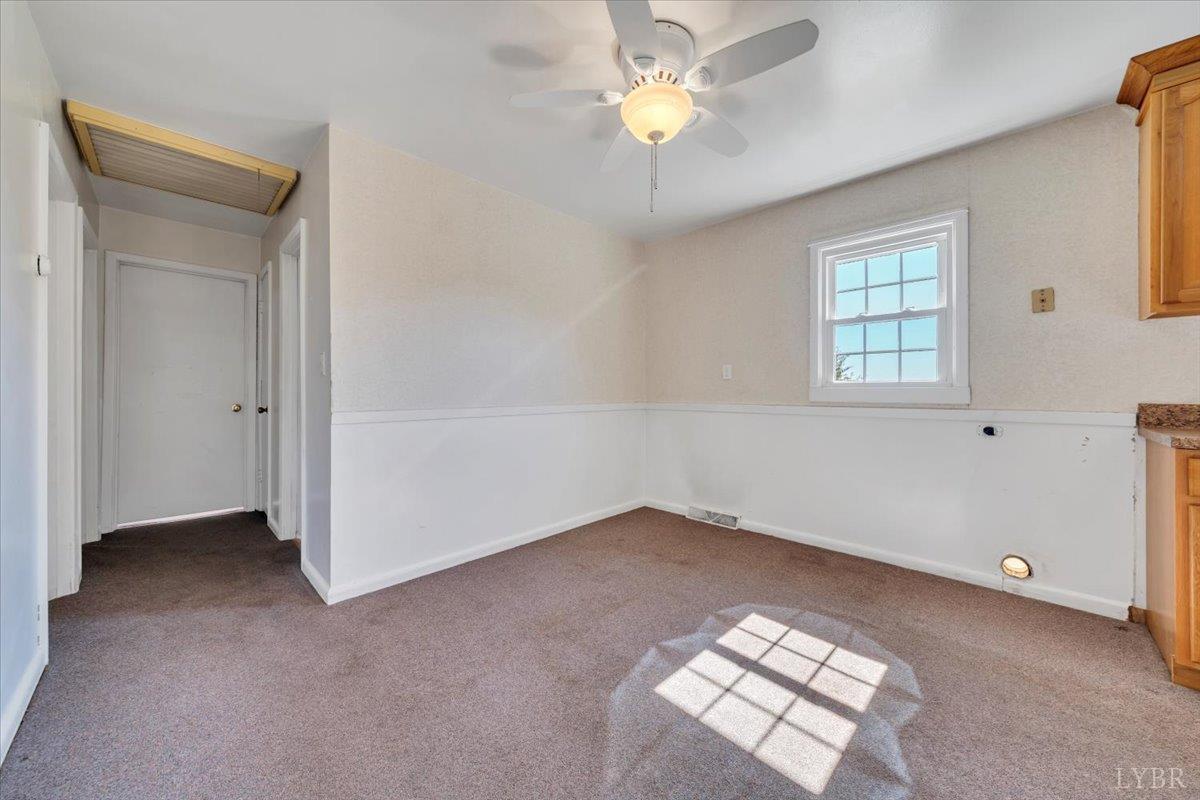 4152 Blue Ridge Drive Gretna, VA 24557 - Photo 17 of 74 an empty room with windows and fan