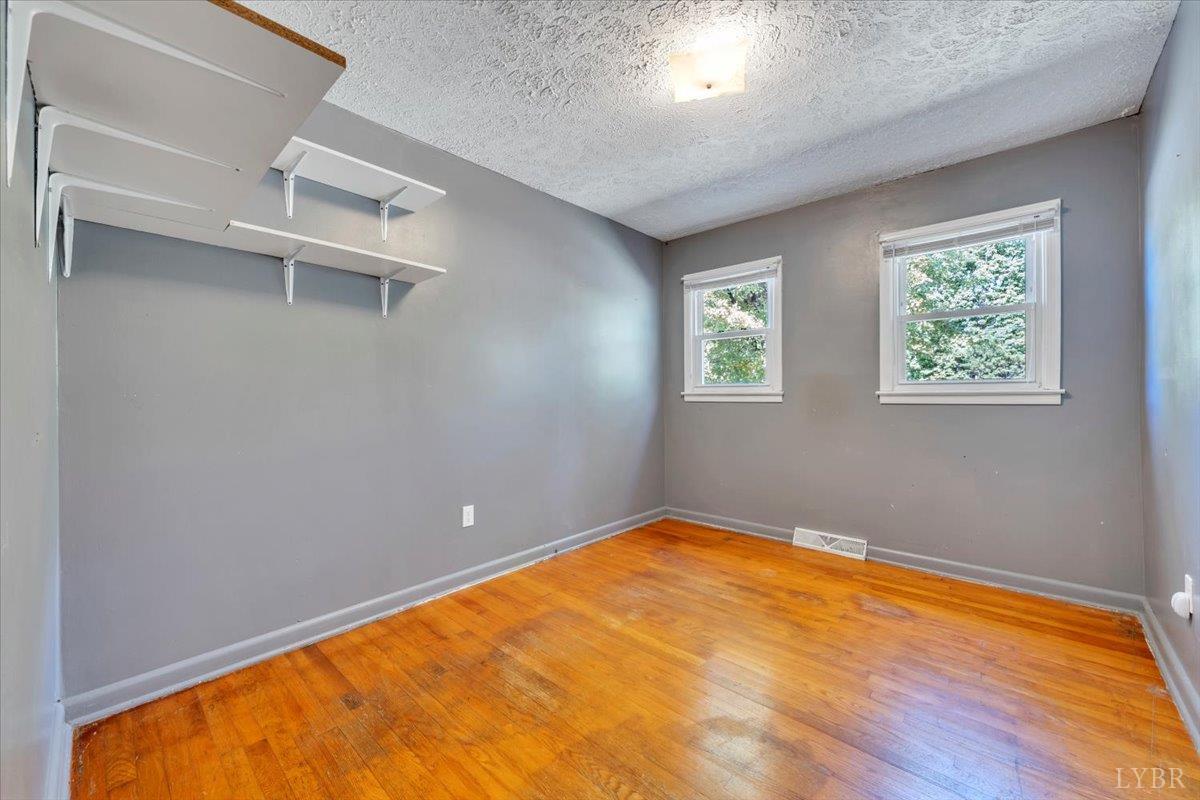 4152 Blue Ridge Drive Gretna, VA 24557 - Photo 20 of 74 a view of empty room with wooden floor