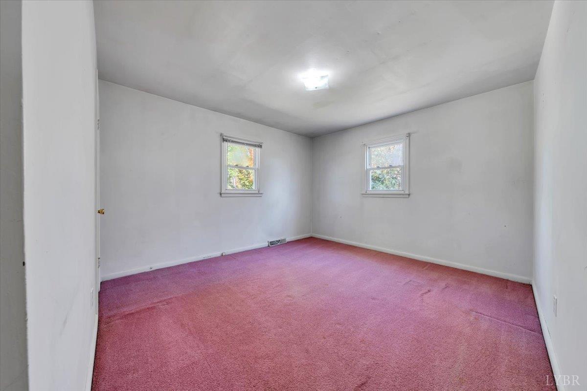 4152 Blue Ridge Drive Gretna, VA 24557 - Photo 24 of 74 an empty room with windows