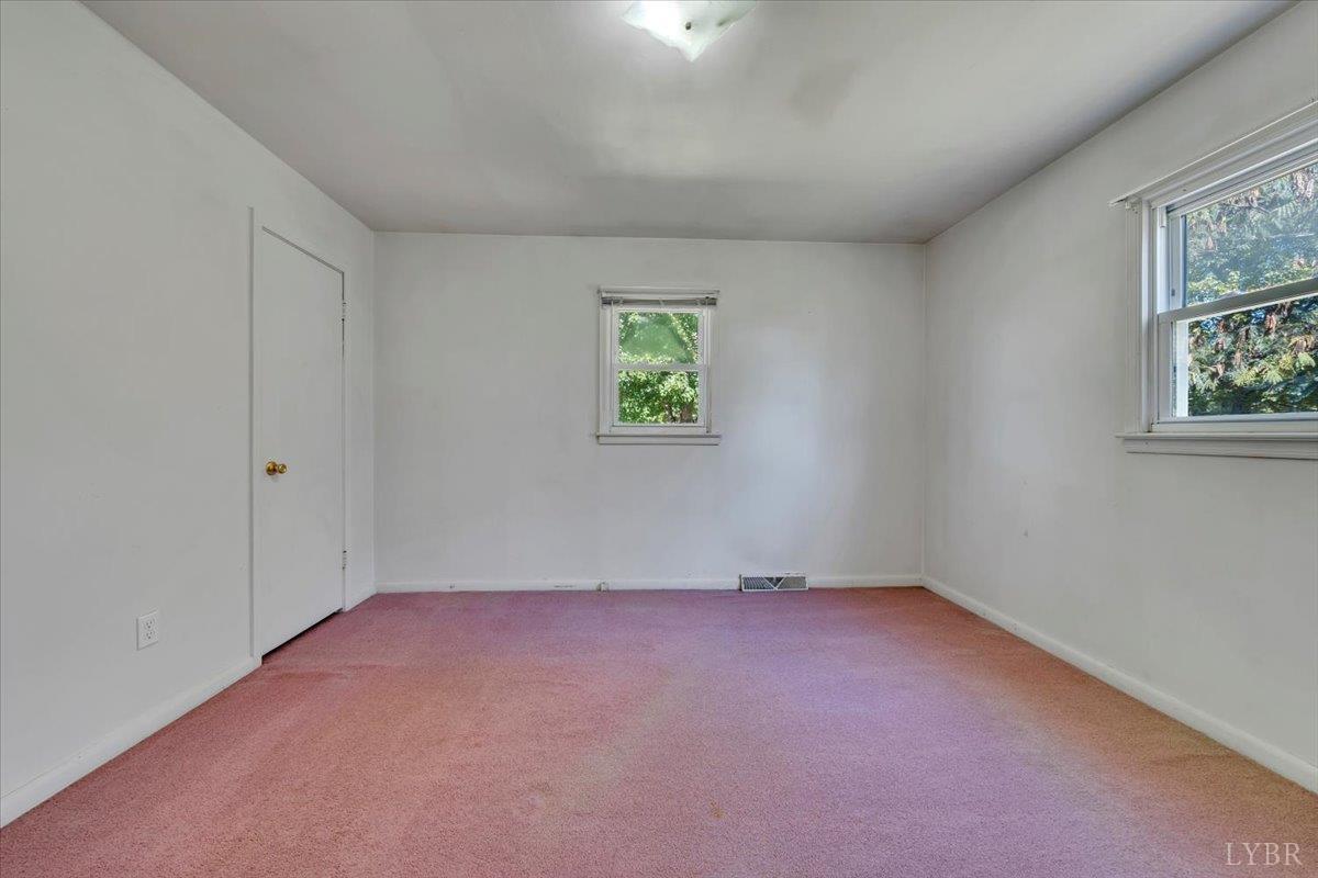 4152 Blue Ridge Drive Gretna, VA 24557 - Photo 25 of 74 an empty room with windows