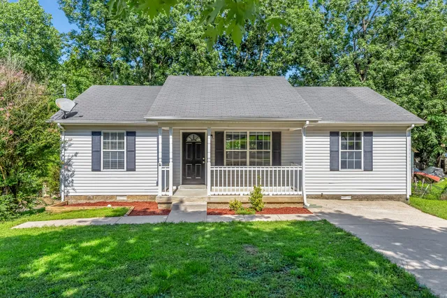 a house view with a garden space