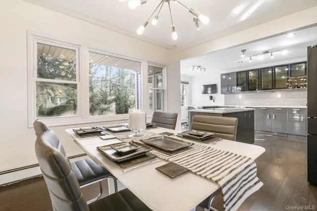 a living room with furniture and flat screen tv