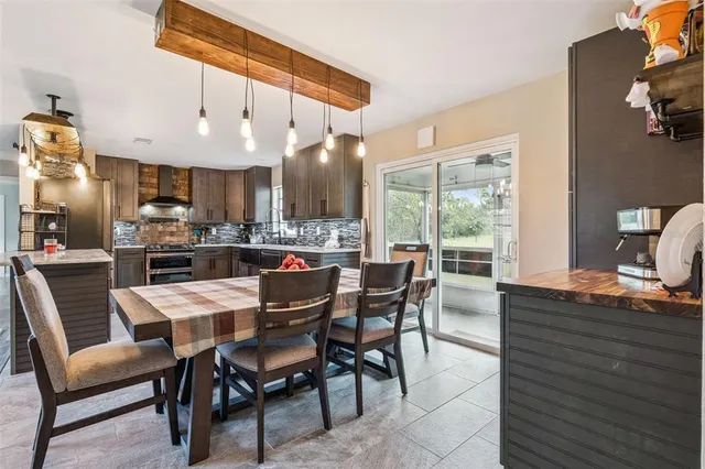 a view of a dining room kitchen and furniture