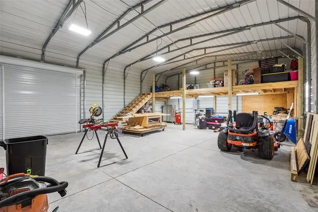 a view of a patio with table and chairs