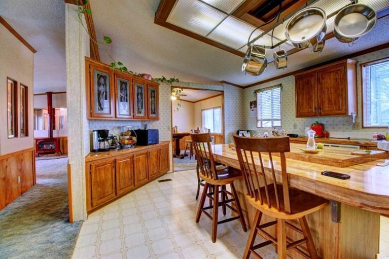 8085 High Banks Road Central Point, OR 97502 - Photo 22 of 35 a view of a dining room with furniture and a chandelier