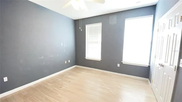 a view of an empty room with a window