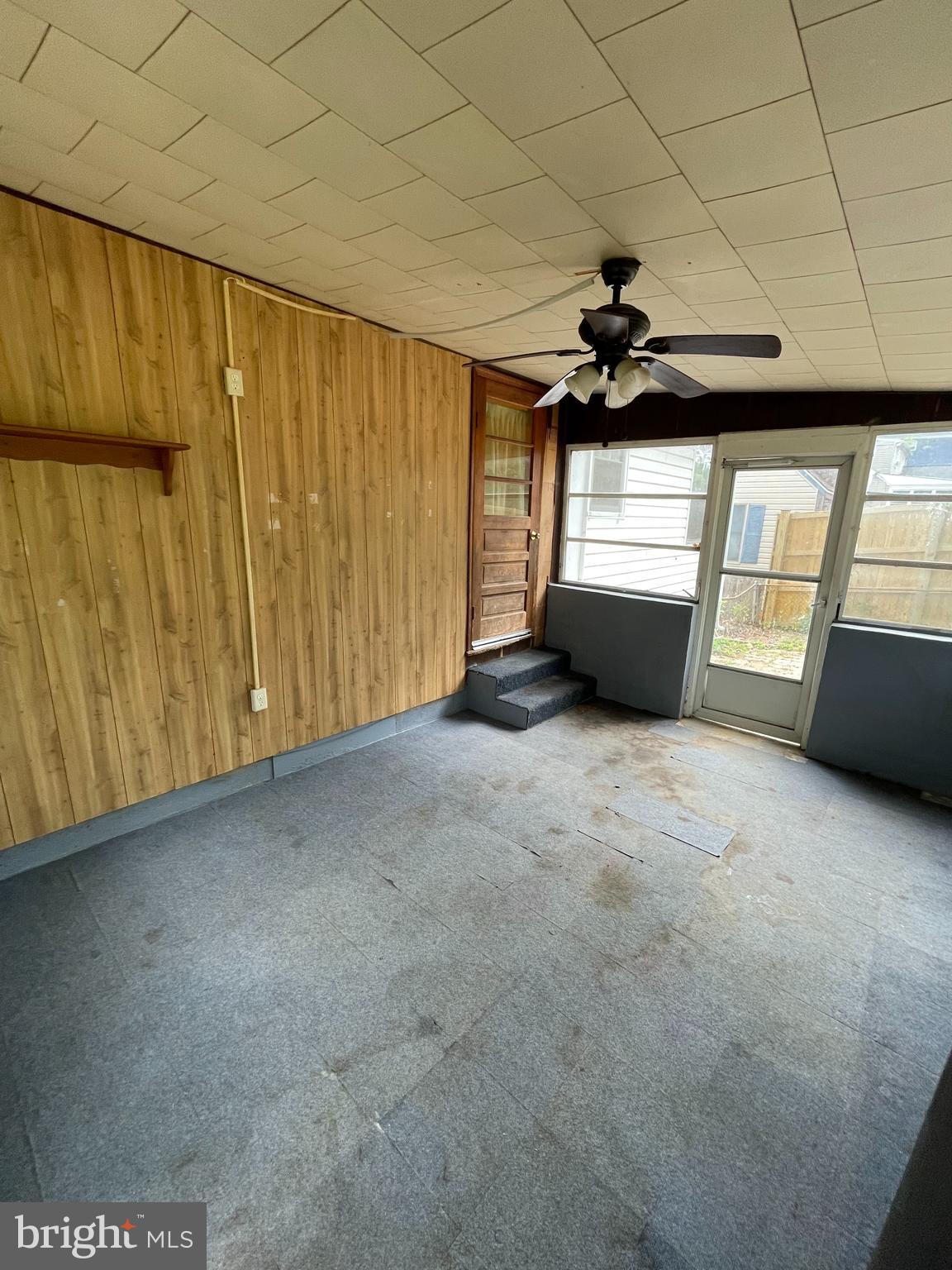 415 West Maple Road Linthicum Heights, MD 21090 - Photo 11 of 12 a view of a livingroom with a ceiling fan and window