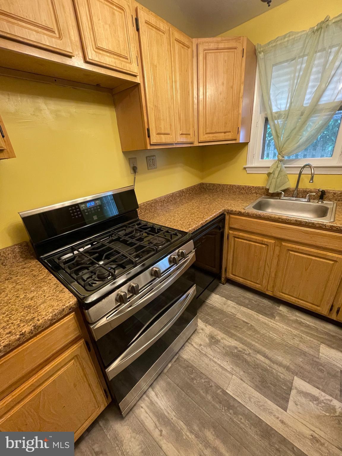 415 West Maple Road Linthicum Heights, MD 21090 - Photo 9 of 12 a kitchen with a stove and a sink