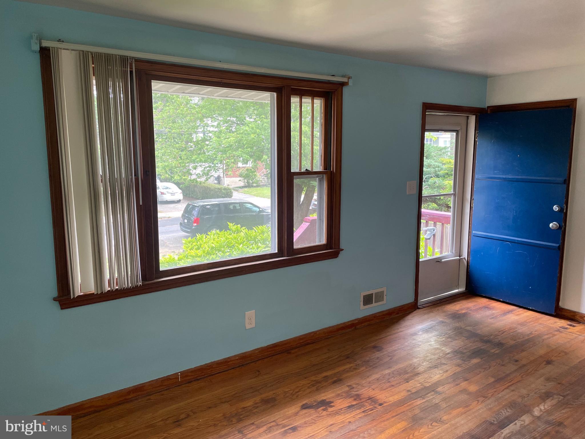 415 West Maple Road Linthicum Heights, MD 21090 - Photo 10 of 12 a view of empty room with window and wooden floor