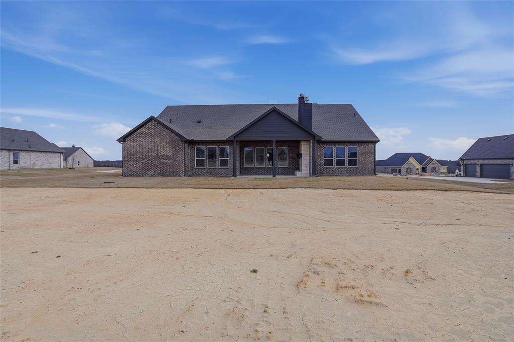 812 Vly Rdg Road Van Alstyne, TX 75495 - Photo 30 of 33 a house with a wooden fence