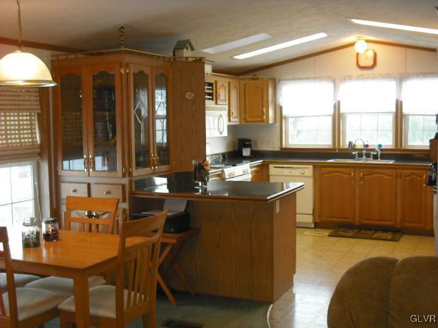 3261 Penn Dixie Road Nazareth, PA 18064 - Photo 8 of 30 a kitchen with a table chairs in it and wooden floor