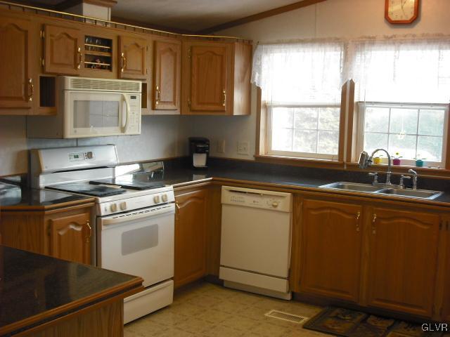3261 Penn Dixie Road Nazareth, PA 18064 - Photo 9 of 30 a kitchen with stainless steel appliances granite countertop a sink a stove and a microwave