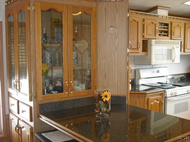 3261 Penn Dixie Road Nazareth, PA 18064 - Photo 10 of 30 a bathroom with a granite countertop sink and a mirror