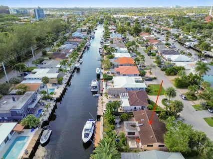 an aerial view of residential houses with outdoor space