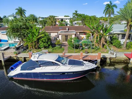 a view of a swimming pool with lounge chairs