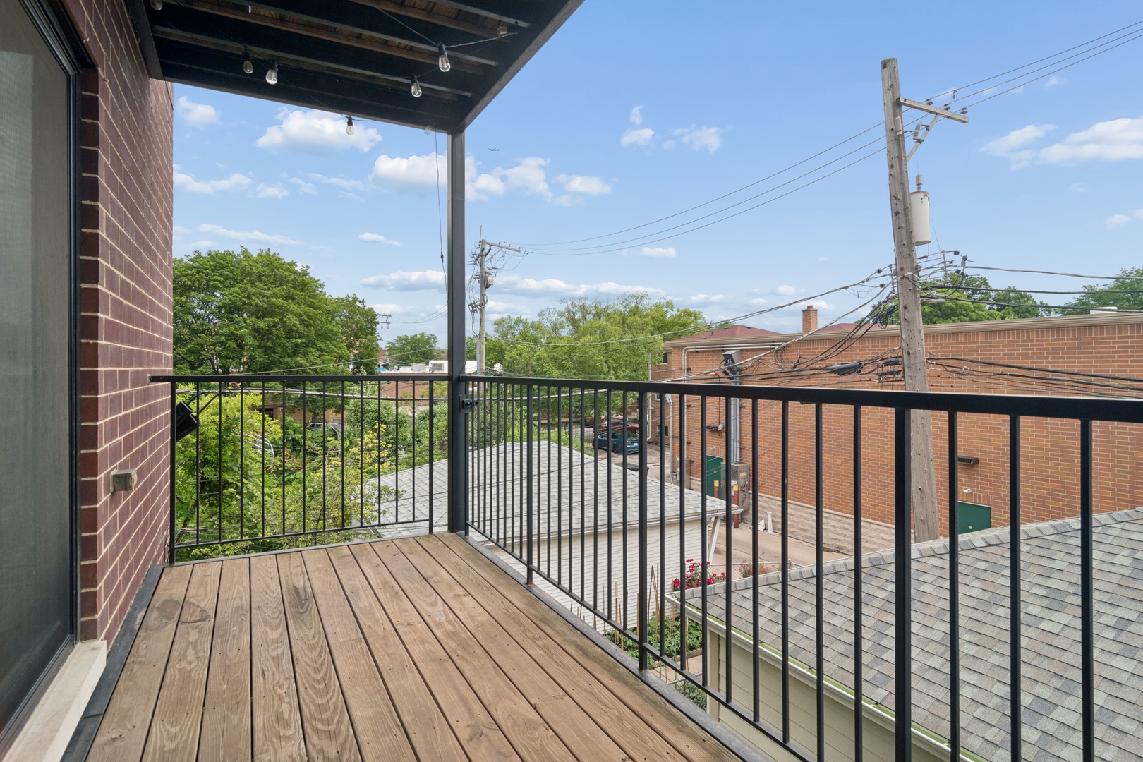 4845 North Keystone Avenue, Unit 2N Chicago, IL 60630 - Photo 15 of 21 a view of a balcony with wooden floor