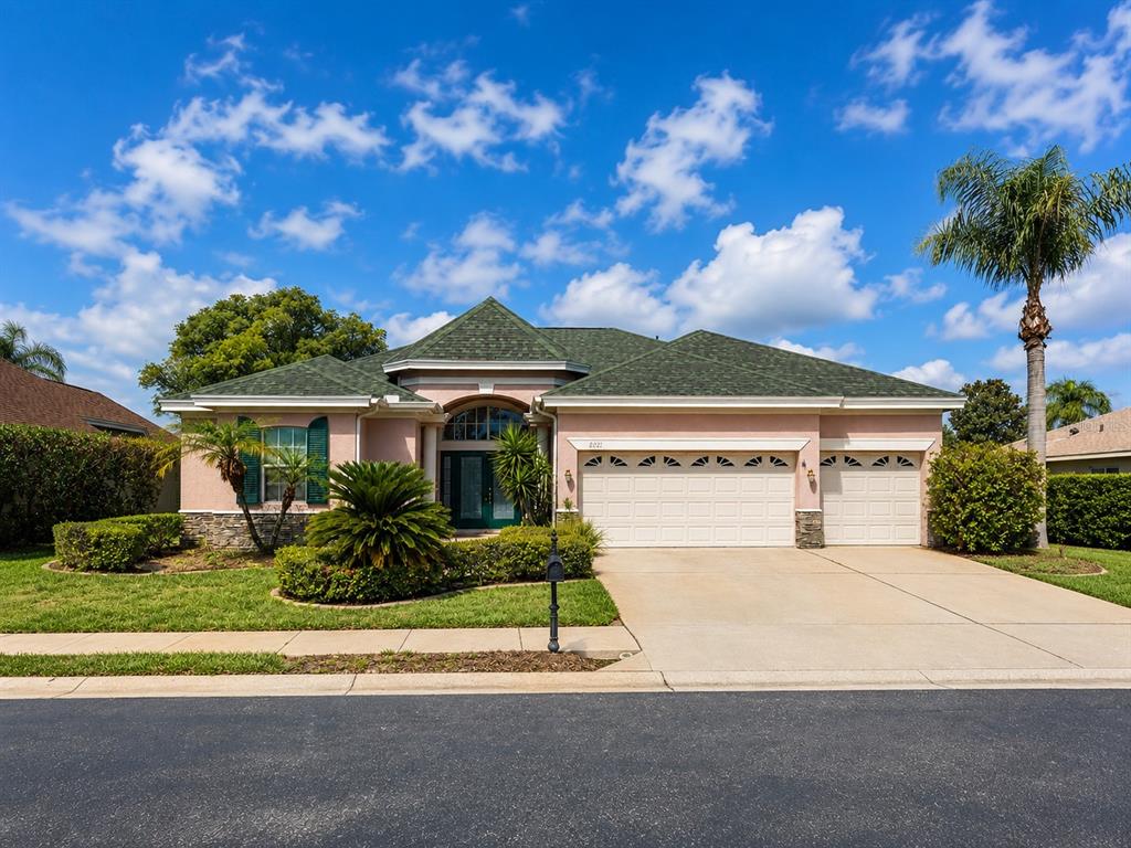 2021 Blue Beech Court Trinity, FL 34655 - Photo 2 of 2 a front view of a house with a yard and garage