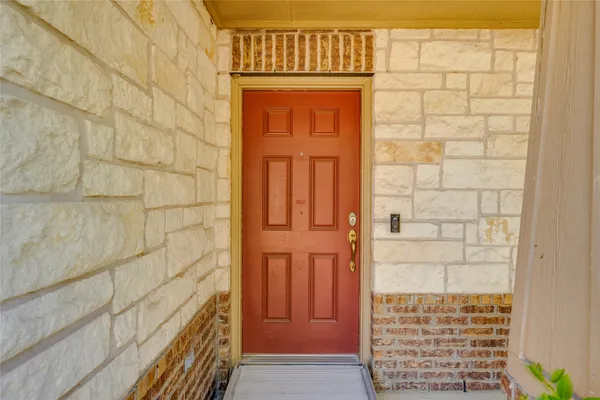 a kitchen with a cabinets and chairs in it