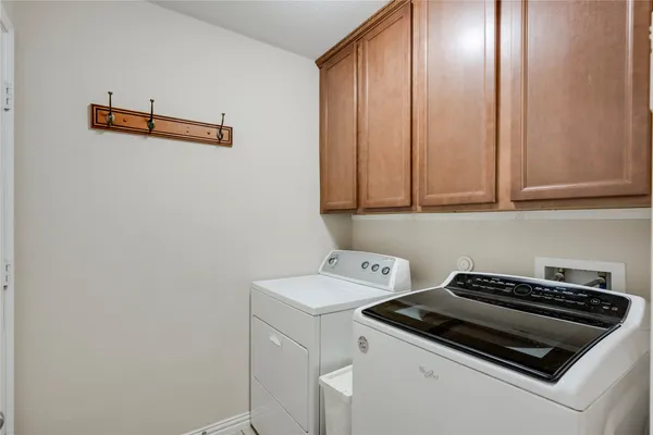a view of backyard with wooden fence