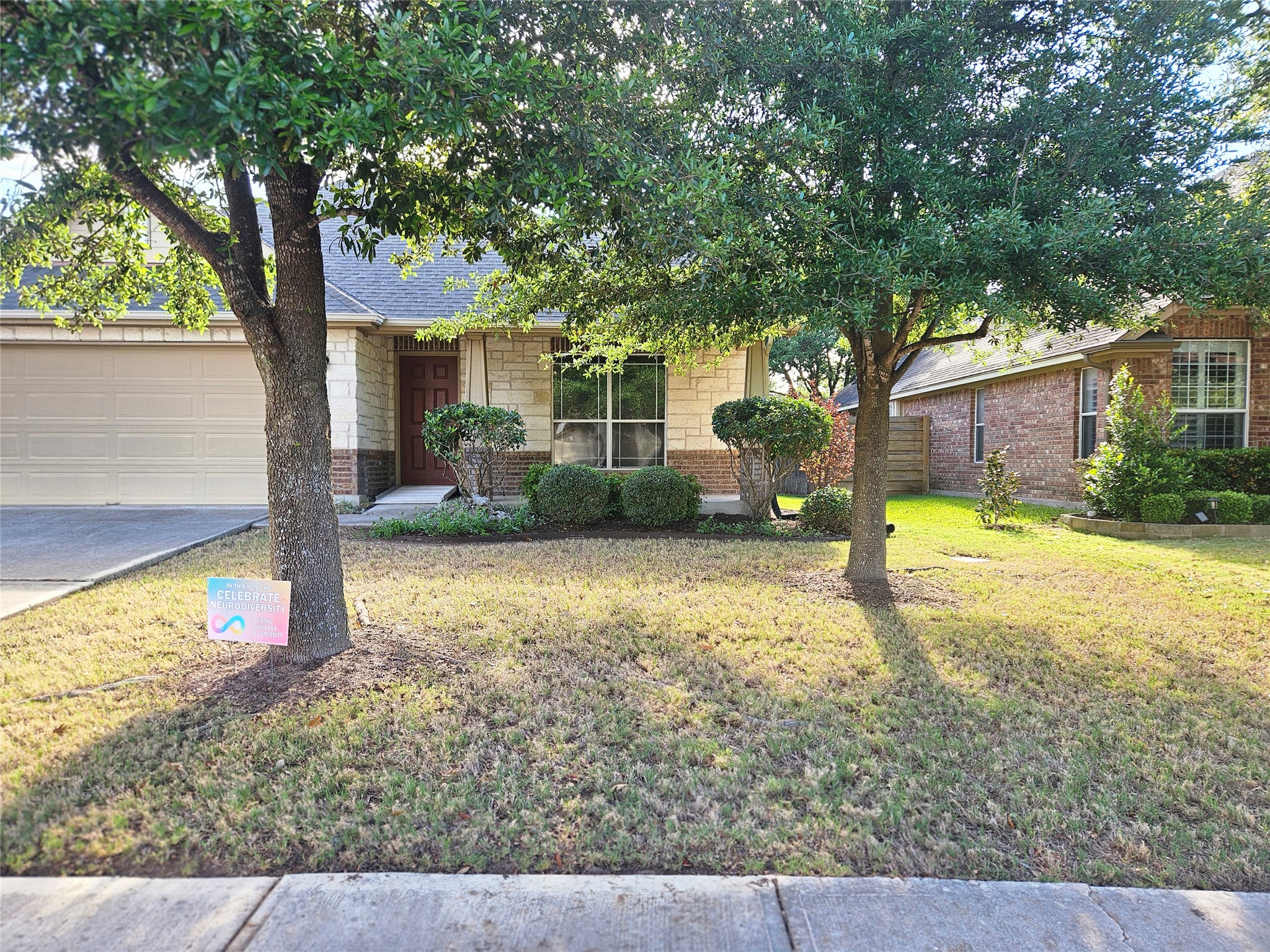 1323 Talley Loop Buda, TX 78610 - Photo 32 of 32 a house with trees in the background