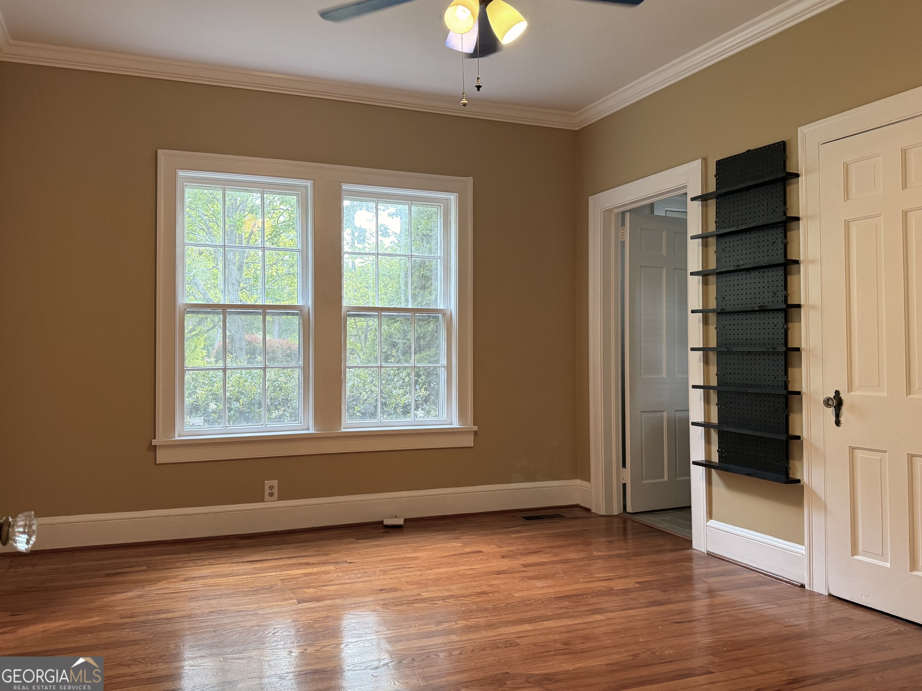 19 Berckmans Lane Southwest Rome, GA 30165 - Photo 18 of 32 a view of an empty room with wooden floor and a window