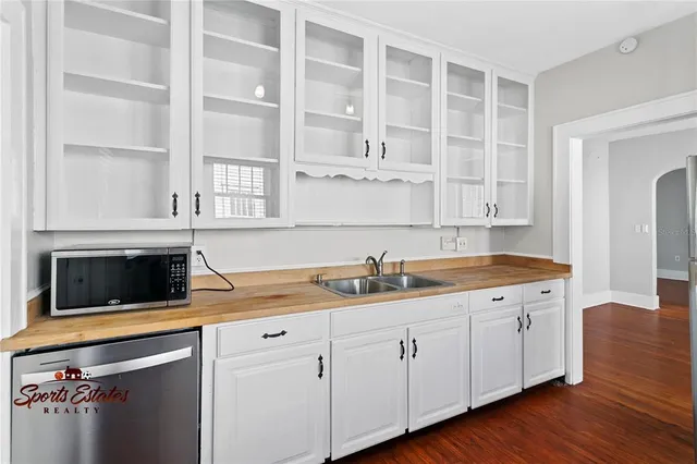 a kitchen with a sink and cabinets