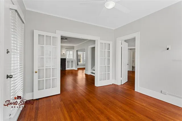wooden floor in an empty room with a window