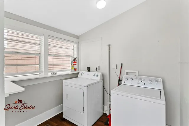 a view of storage and utility room with washer and dryer