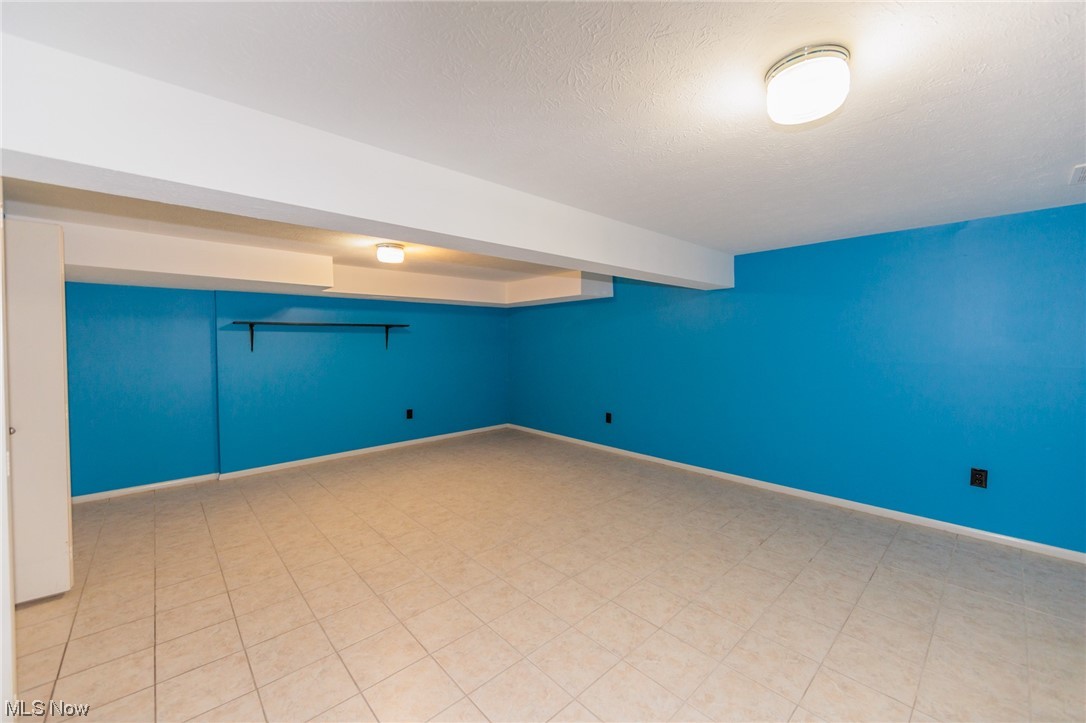 6472 State Road, Unit J19 Parma, OH 44134 - Photo 31 of 33 Tiled spare room with a textured ceiling