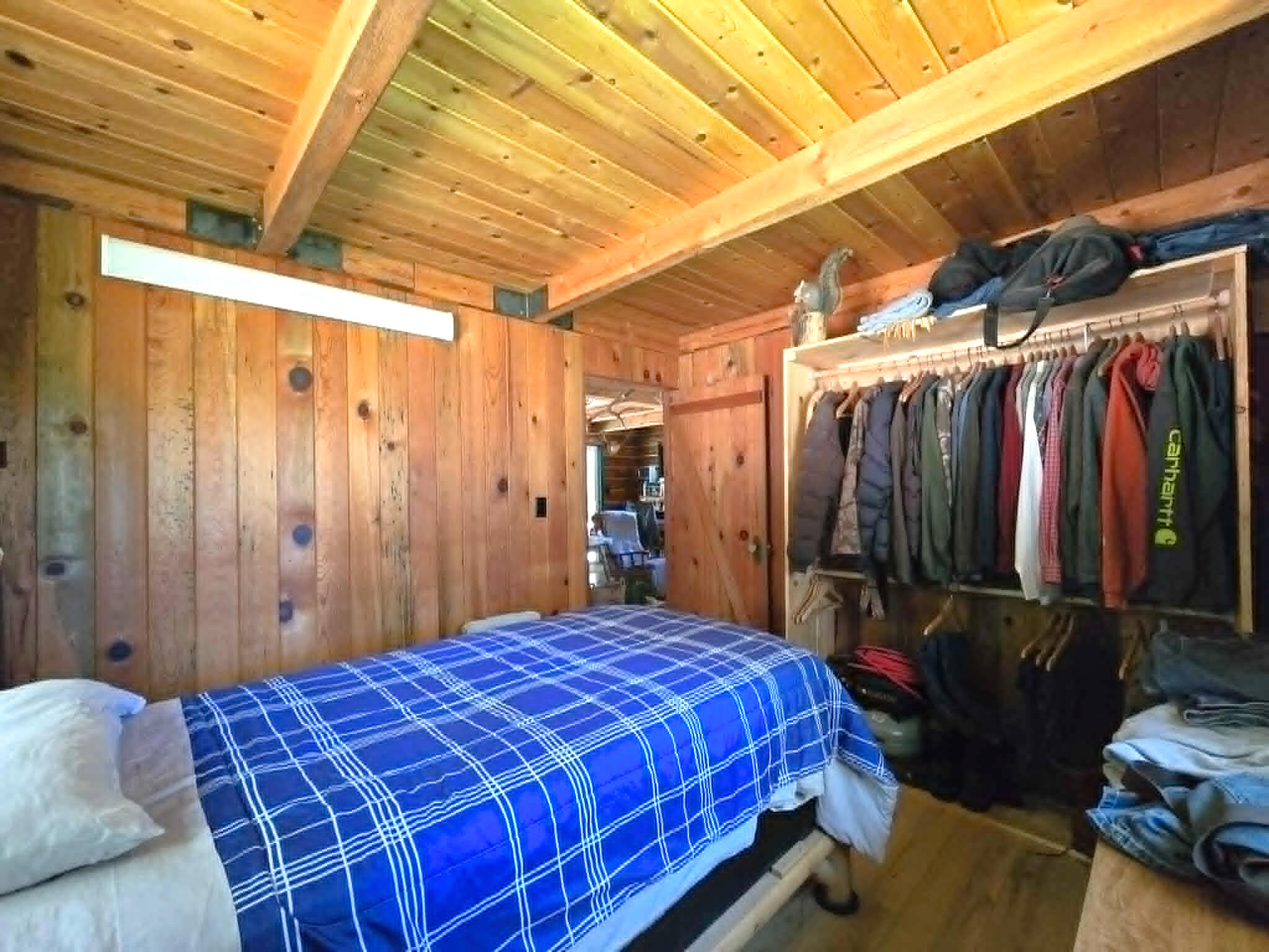 836 Ulrich Road Prospect, OR 97536 - Photo 18 of 47 a bed room with a bed and a walk in closet