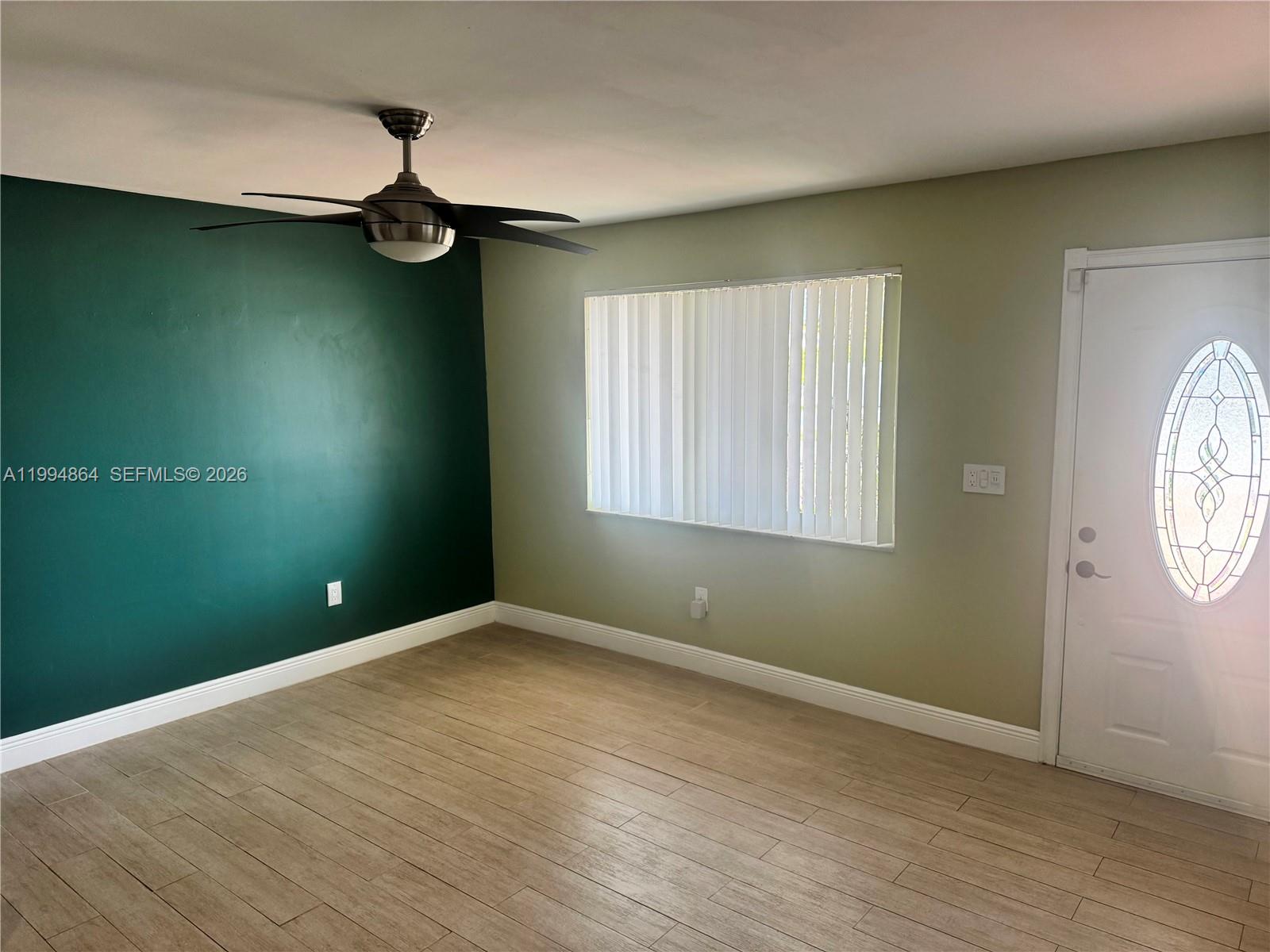 10760 Southwest 63rd Street Miami, FL 33173 - Photo 17 of 61 an empty room with a window