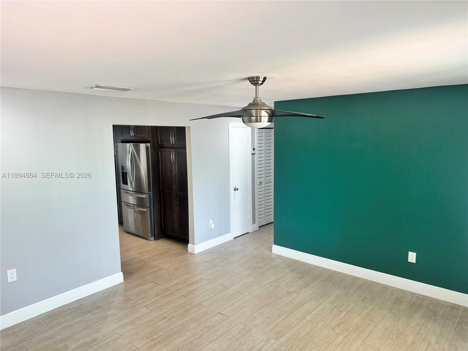 10760 Southwest 63rd Street Miami, FL 33173 - Photo 18 of 61 a view of a room with a refrigerator and window