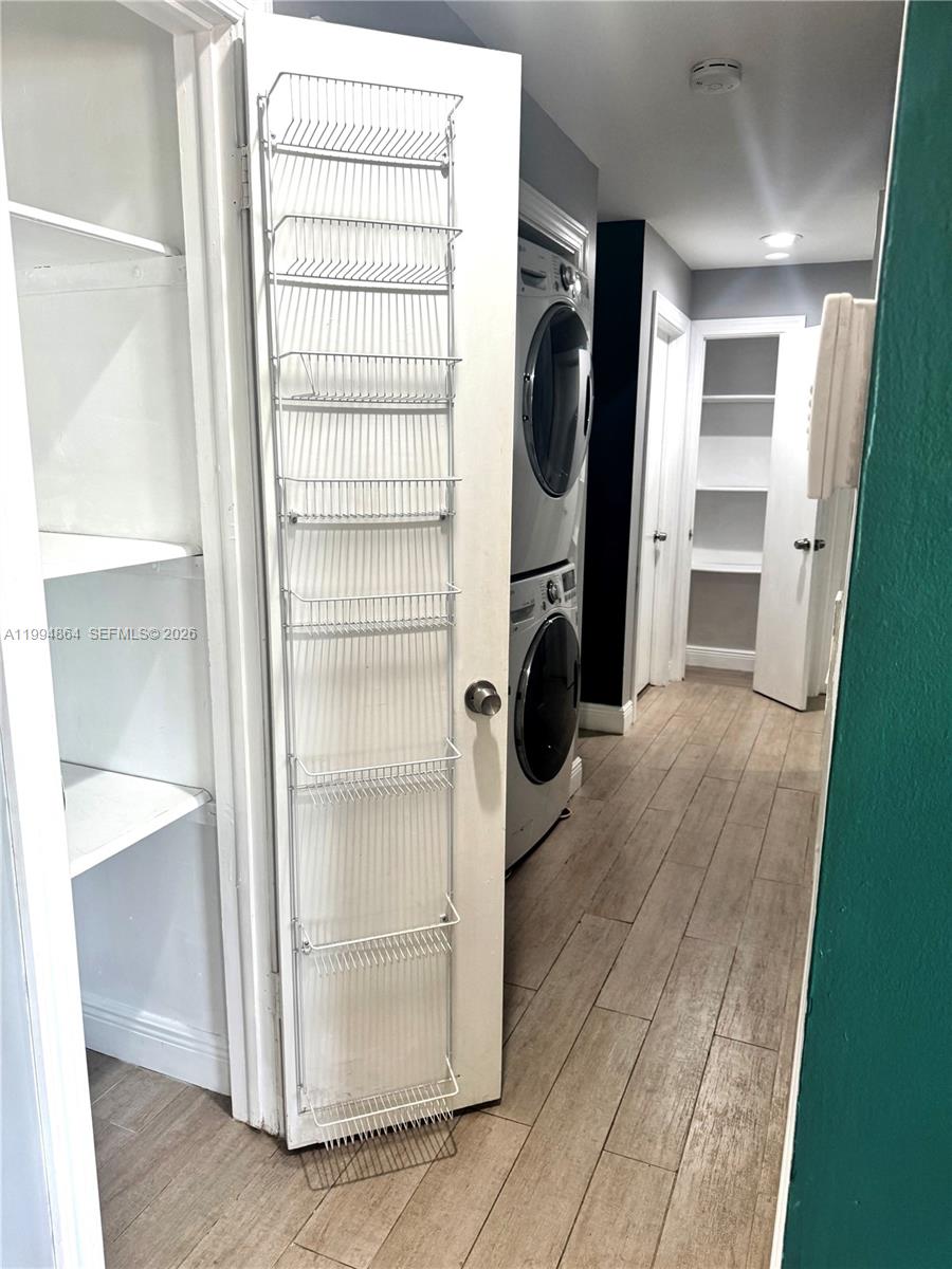 10760 Southwest 63rd Street Miami, FL 33173 - Photo 20 of 61 a view of walk in closet with clothes and shoes