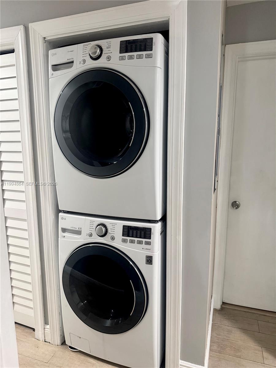 10760 Southwest 63rd Street Miami, FL 33173 - Photo 21 of 61 a utility room with dryer and washer