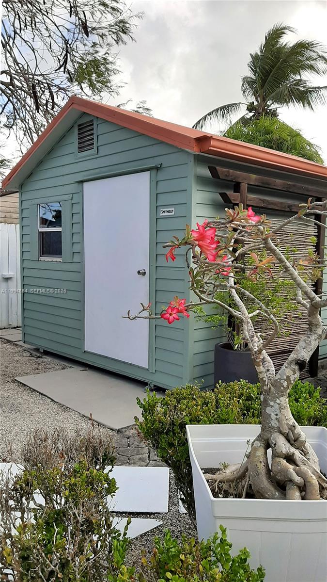 10760 Southwest 63rd Street Miami, FL 33173 - Photo 40 of 61 a front view of a house with yard
