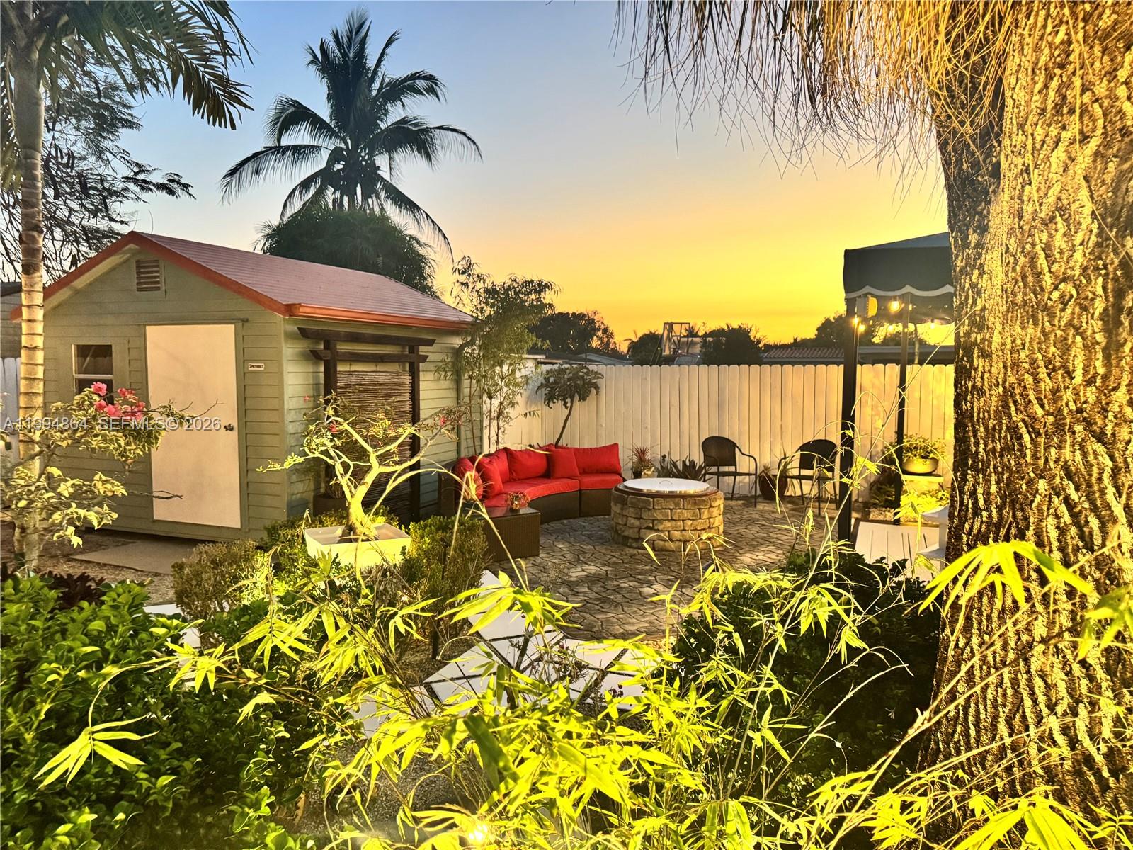 10760 Southwest 63rd Street Miami, FL 33173 - Photo 41 of 61 a view of a lake with a house in the background