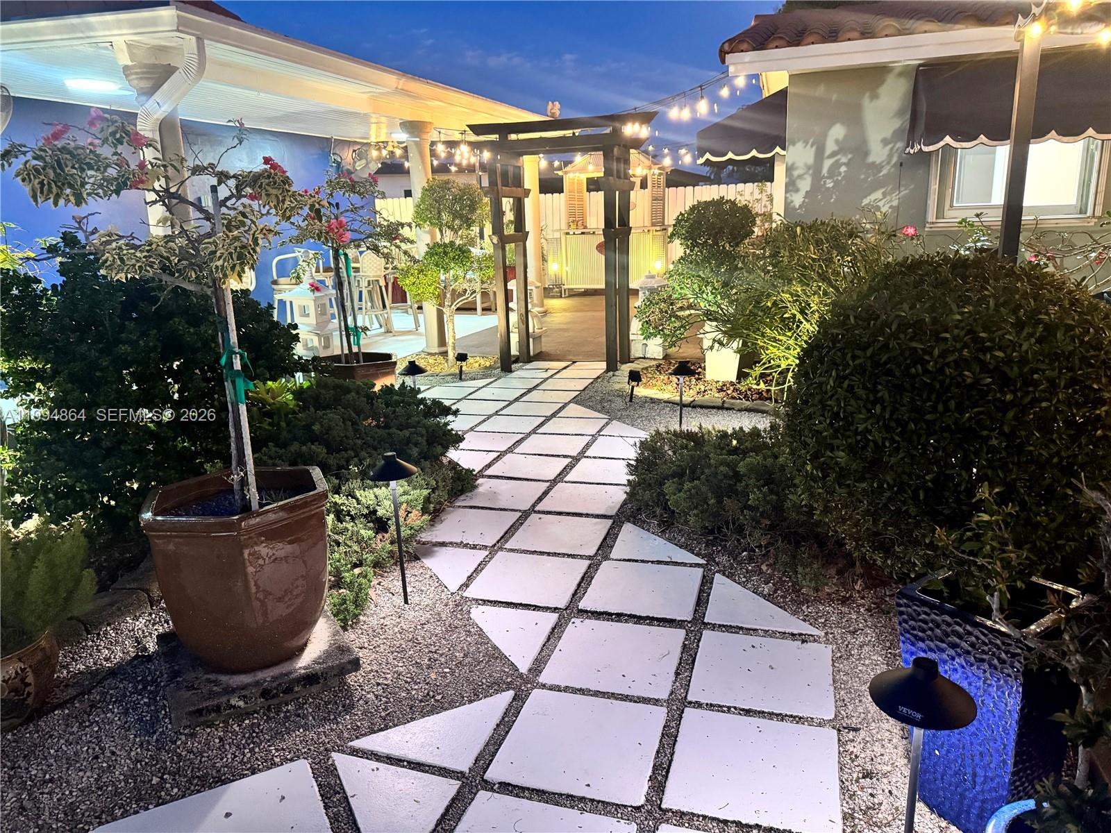 10760 Southwest 63rd Street Miami, FL 33173 - Photo 47 of 61 a view of a backyard with sitting area