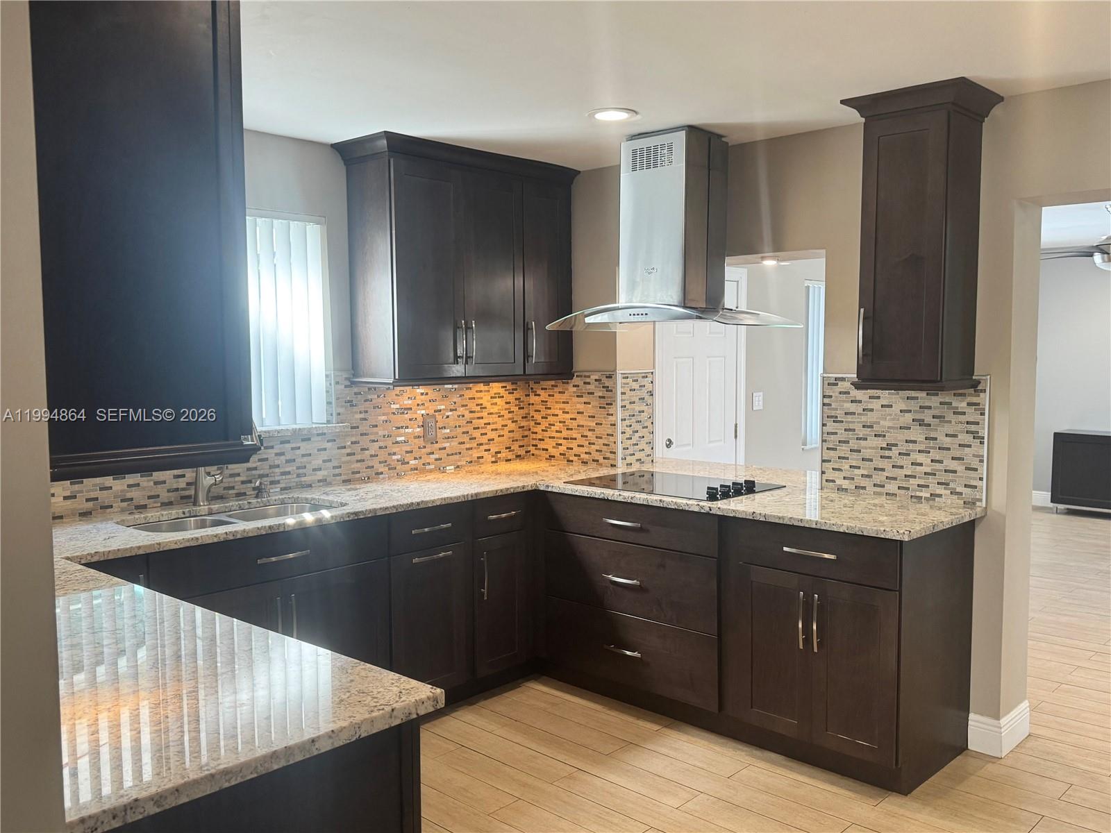 10760 Southwest 63rd Street Miami, FL 33173 - Photo 5 of 61 a kitchen with a sink and cabinets