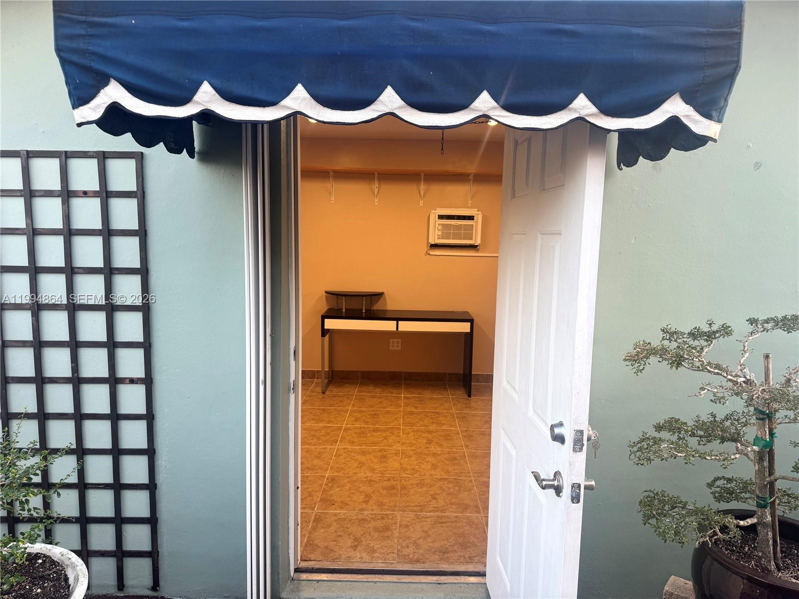 10760 Southwest 63rd Street Miami, FL 33173 - Photo 53 of 61 a bathroom with a bathtub and a shower